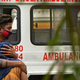Family members mourn after they received the body of a patient who died of covid-19 at a mortuary in New Delhi, India on May 18, 2021.